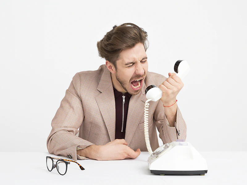 Salesperson frustrated on a phone call
