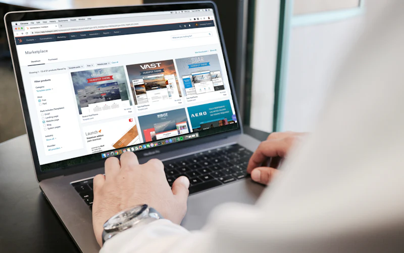 Person reviewing a website design on a laptop