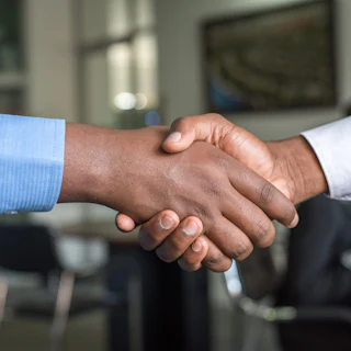 Business handshake closing a deal