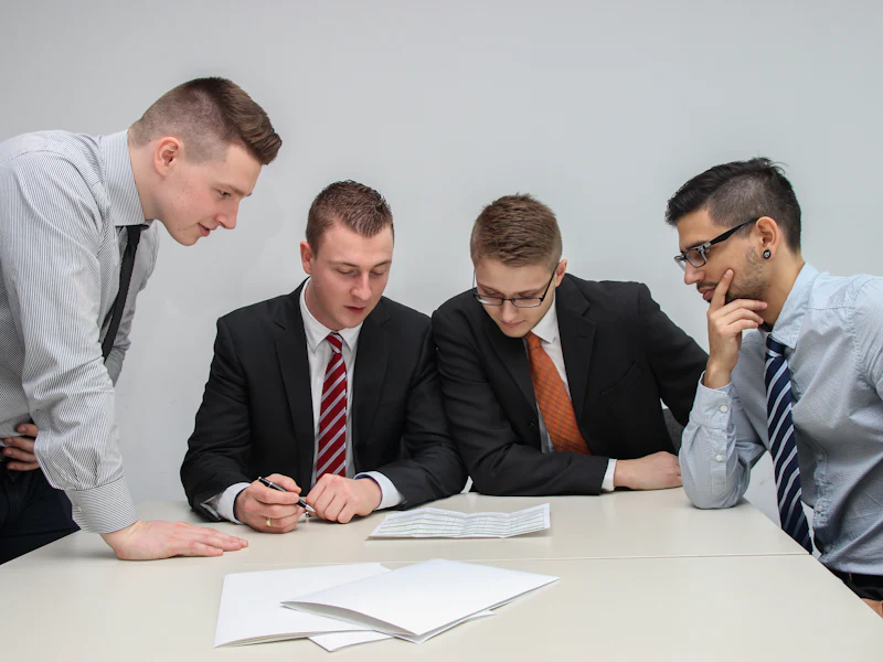 Team puzzling over a report at a table